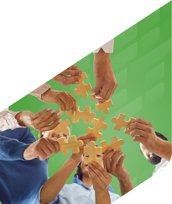 Hands holding puzzle pieces together